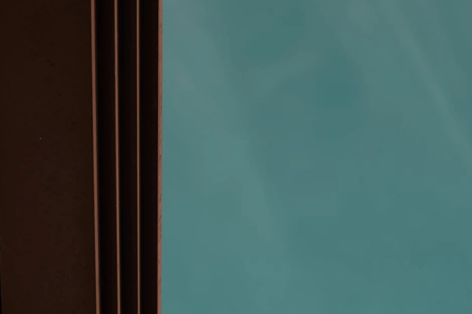 A modern art gallery with minimalist decor and abstract paintings.